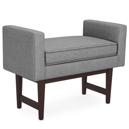 The Scott Upholstered Ottoman Bench features modern gray upholstery, rectangular arms, a cushioned seat, and dark wooden legs, shown against a white background.