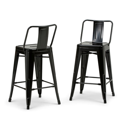 Two Rayne Multifunctional Metal Stools in tall black metal, each with a backrest and footrest, feature a minimalist industrial design. Shown at slight angles to display both front and side views.
