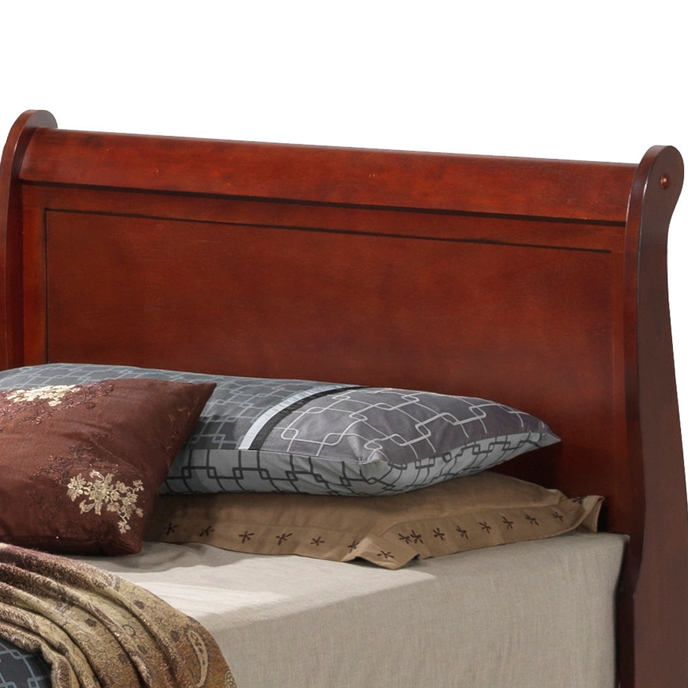 A close-up of the Louis Phillipe - Storage Bed features a rich dark brown wooden headboard, styled with beige sheets, gray and patterned pillows, and a brown decorative accent pillow.