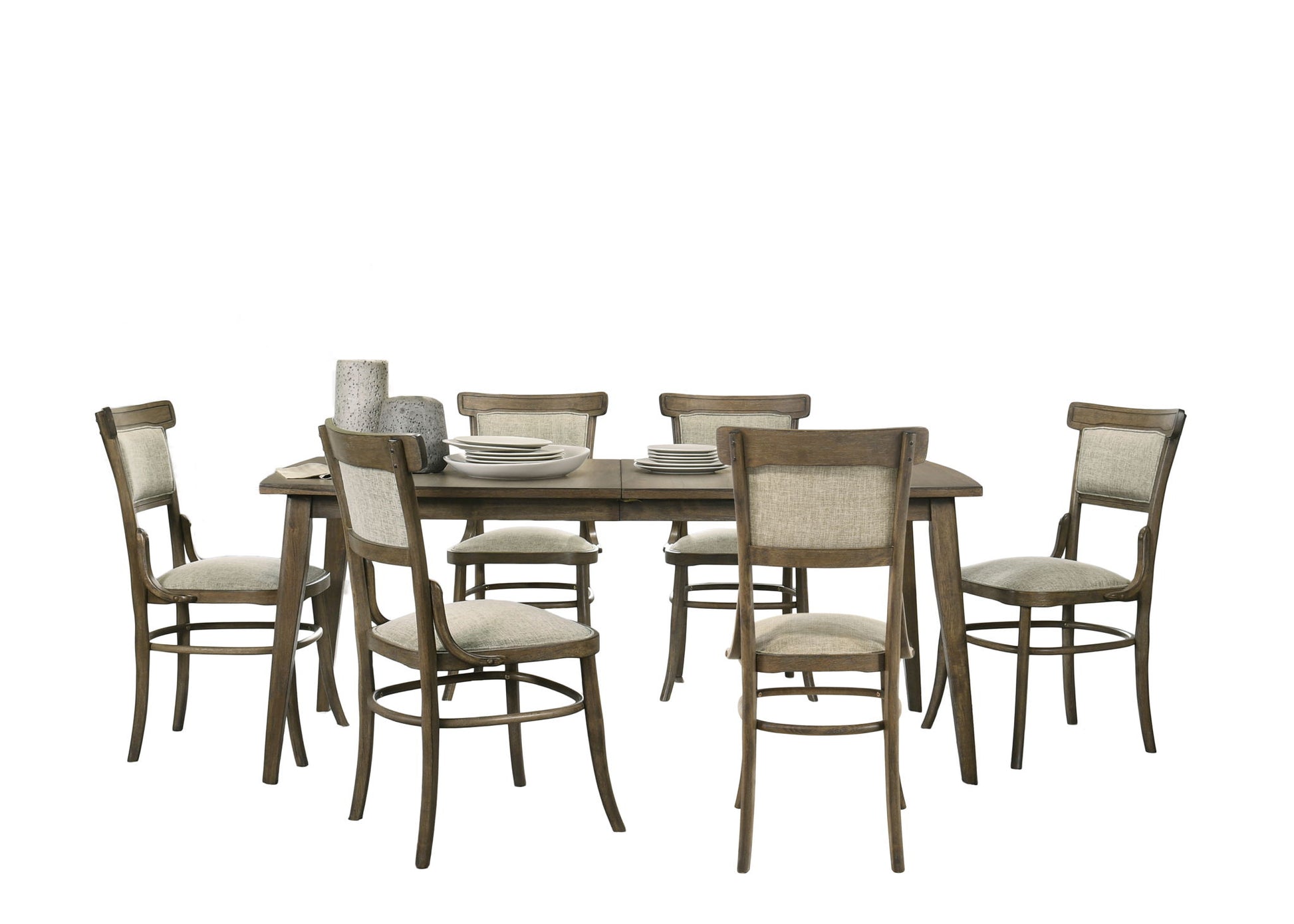 The Bistro Dining Table comes with six off white fabric chairs. The table is styled with stacked plates and ceramic vases, shown on a clean white background.