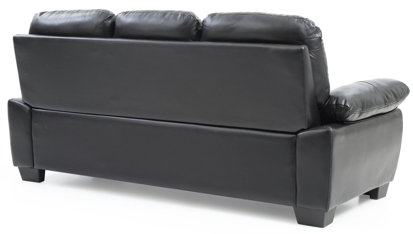 The Marta - Sofa is a black leather sofa with three seat backs, shown from behind at an angle against a white background.