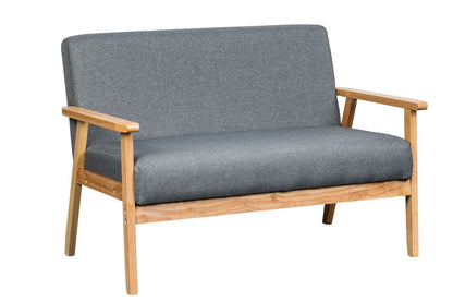 The Bahamas Loveseat features a small, gray upholstered design with light wooden arms and legs, offering a simple, modern aesthetic.
