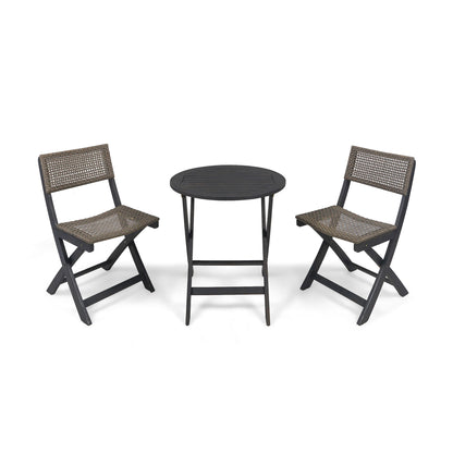 The Evergreen Outdoor Dining Set features a small round black table and two matching folding chairs with woven brown seats and backs, presented against a plain white background.