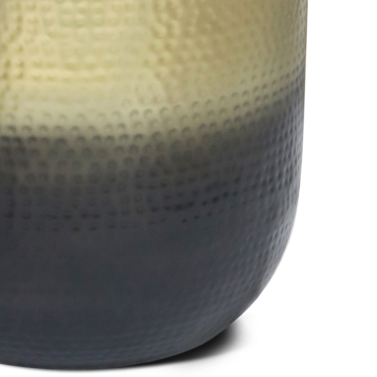 Close-up of the Nova - Handcrafted Metal Side Table, featuring a textured surface with a gradient finish that transitions from light beige at the top to dark gray at the base.