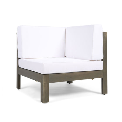The Oana - Arm Chair features a modern dark wooden frame and thick white seat and back cushions, shown against a white background.