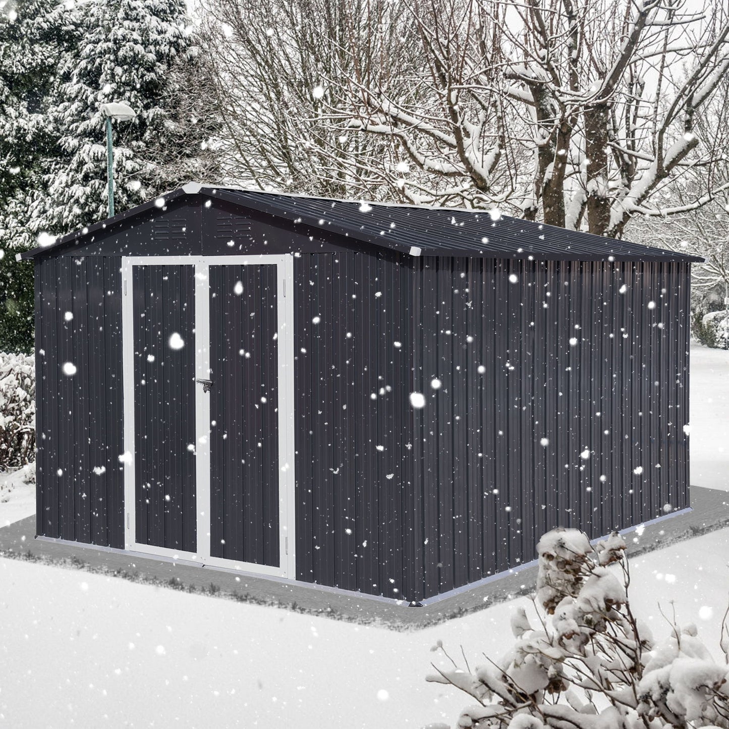 A 10'x12' Garden Sheds Outdoor Storage Shed with white trim sits on a concrete base in a snowy yard, surrounded by leafless trees and snow-covered bushes as snow falls.