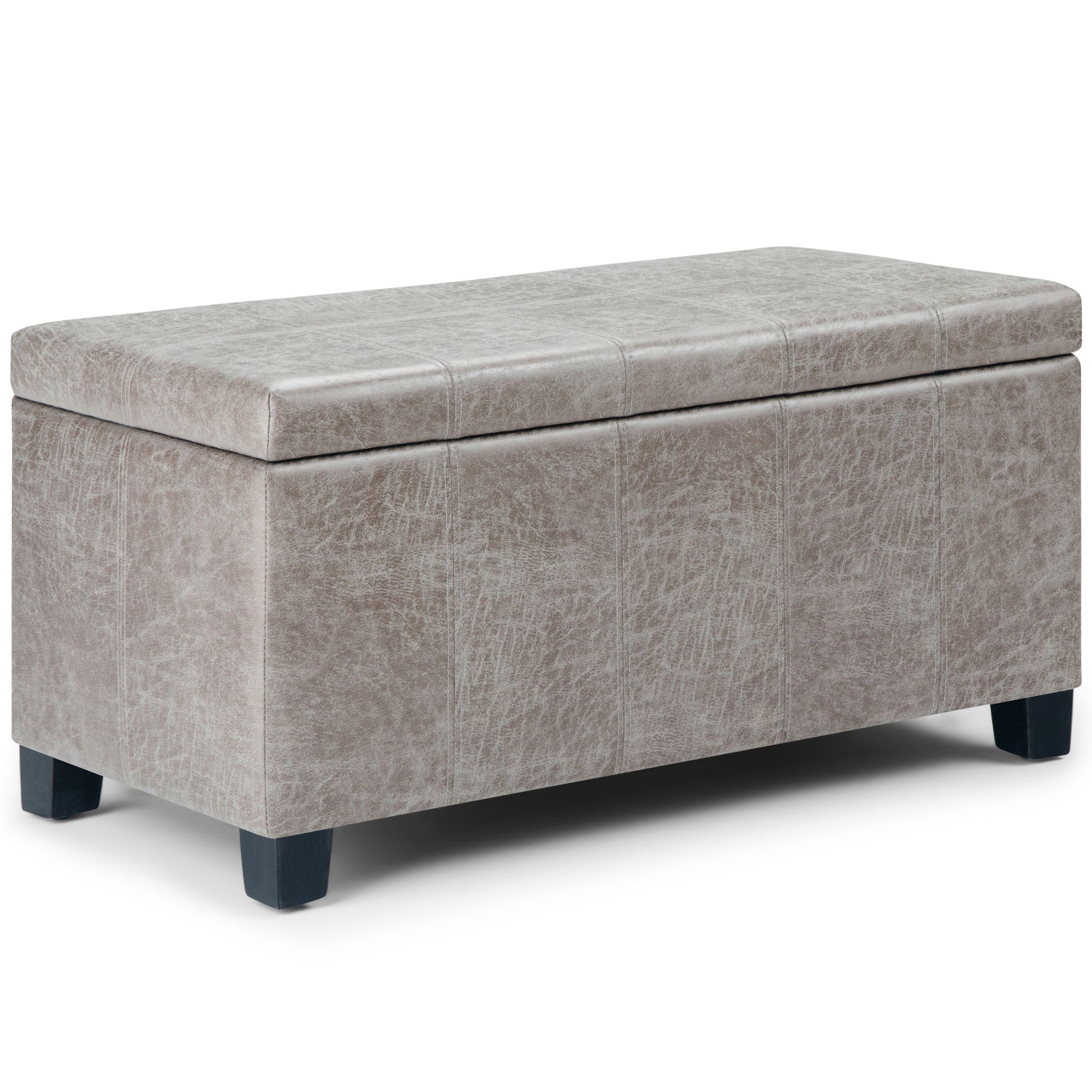 The Dover Upholstered Storage Ottoman Bench features a cushioned lid in light gray faux leather and short black legs, shown against a white background.