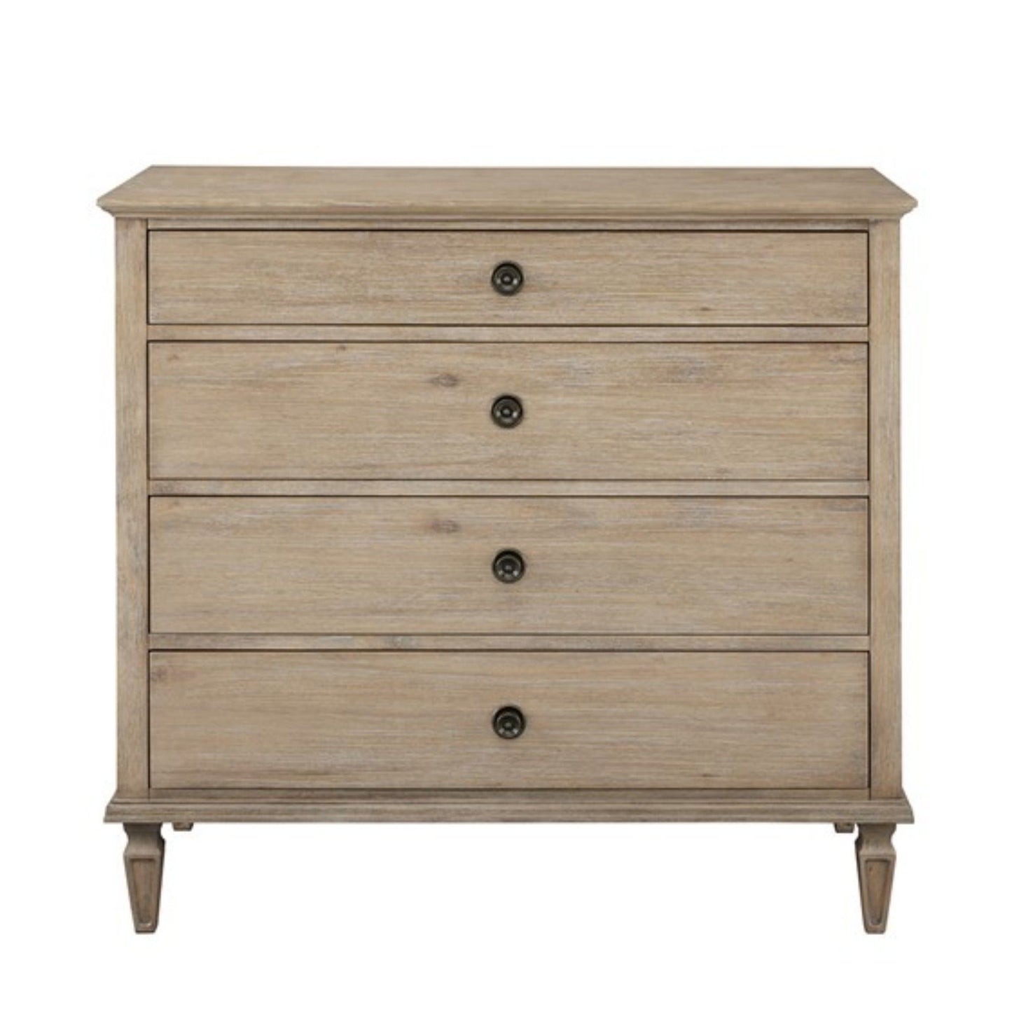 The French Inspired Small Dresser - Wire Brushed Light Natural features four drawers with round black knobs and stands on short, tapered legs, finished in a light wood tone against a plain white background.