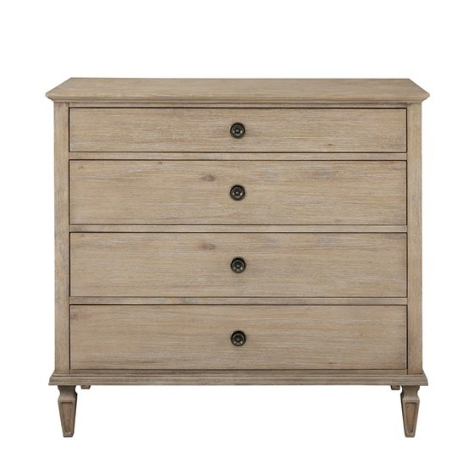 The French Inspired Small Dresser - Wire Brushed Light Natural features four drawers with round black knobs and stands on short, tapered legs, finished in a light wood tone against a plain white background.