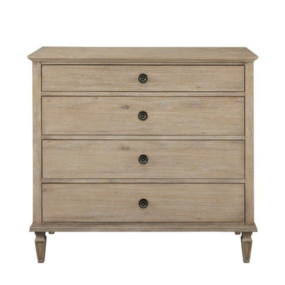 The French Inspired Small Dresser - Wire Brushed Light Natural features four drawers with round black knobs and stands on short, tapered legs, finished in a light wood tone against a plain white background.