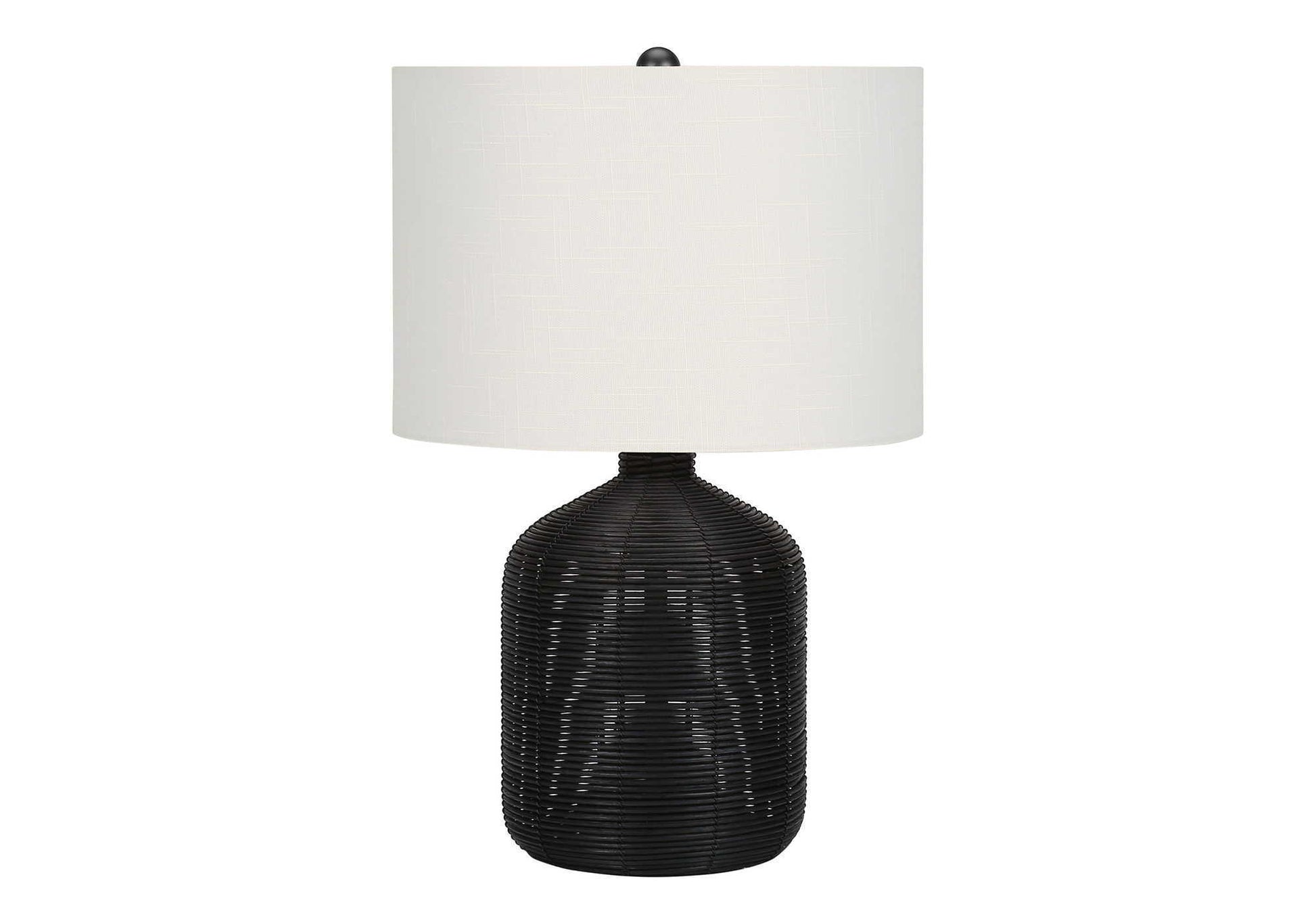A modern table lamp with a rattan-textured, rounded black base and a large cylindrical white shade, shown against a plain white background.