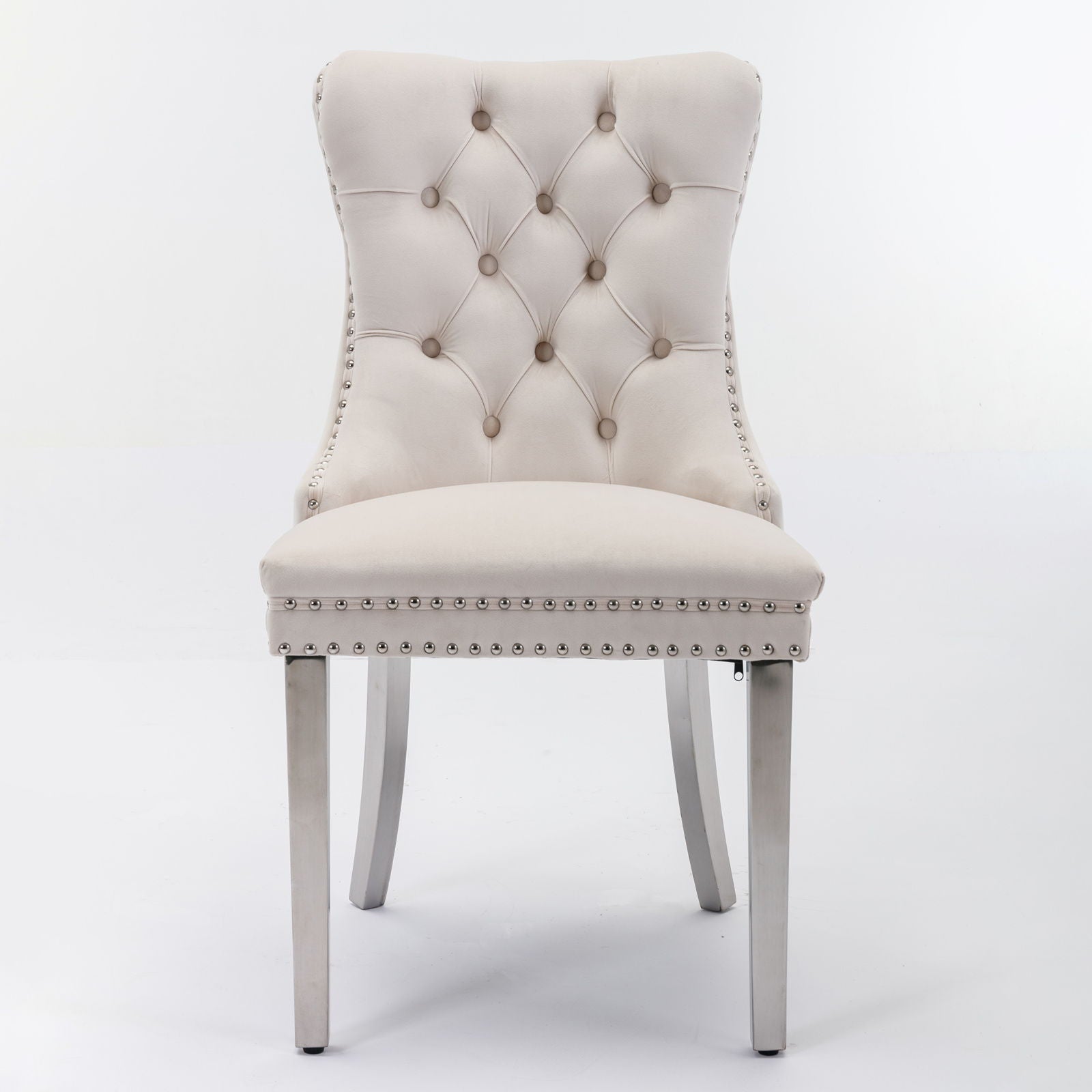 The Nikki set features modern, high-end velvet upholstered dining chairs with tufted backs, chrome stainless steel plated legs, and nailhead trim, perfect for contemporary spaces.