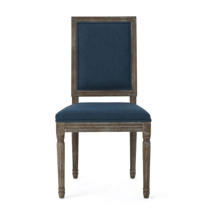 The Traditional Style Dining Chair Set With Fabric Upholstery features carved legs, a rectangular back, and dark blue fabric on the seat and backrest, shown against a plain white background.
