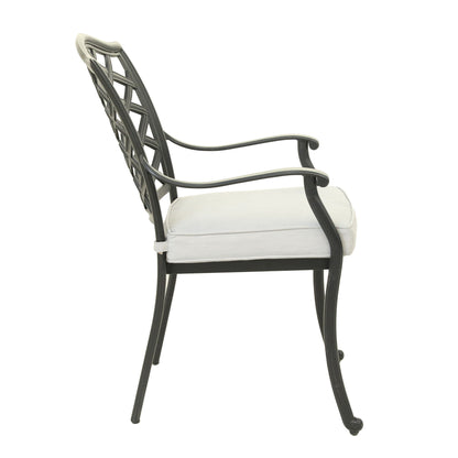 Side view of the Aluminum Dining Arm Chair With Cushion (Set of 2) in Cast Silver, featuring a lattice backrest, armrests, and a light-colored seat cushion.