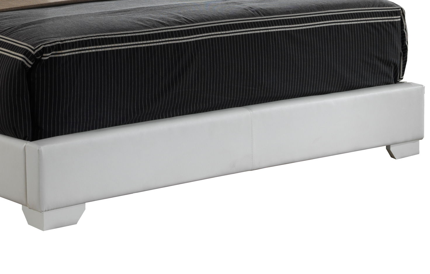 A close-up of the lower part of the Elegant Platform Bed For Relaxed Spaces, featuring a white upholstered frame and a black pinstriped mattress.