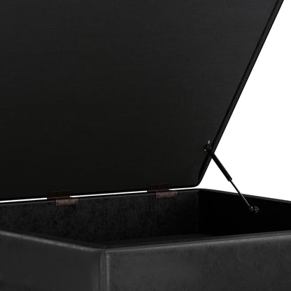 A close-up view of the Owen Multifunctional Square Coffee Table Storage Ottoman in black, featuring an open hinged lid with gas lift support and highlighting its spacious, empty interior.