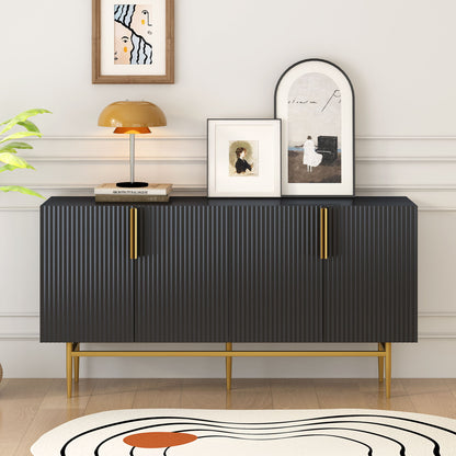 The Modern Elegant 4 Door Sideboard Gold Metal Handle Buffet Cabinet stands against a white wall, topped with framed art, a small portrait, and a brown lamp. A plant and part of a patterned rug are also visible in the room.