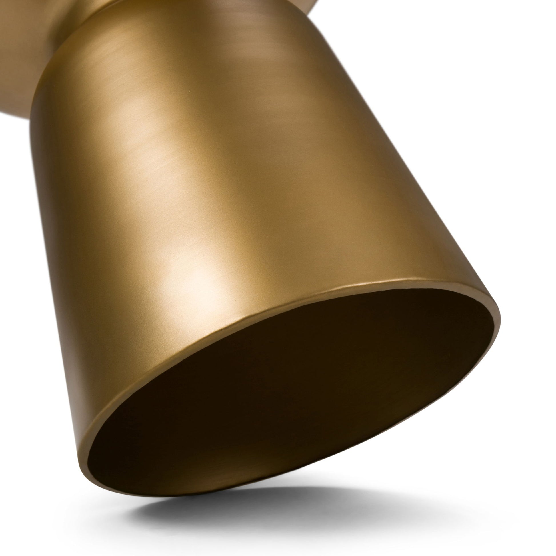 Close-up of the Toby handcrafted metal accent table featuring a modern, metallic gold cylindrical design with a matte finish, photographed from a low angle against a white background.