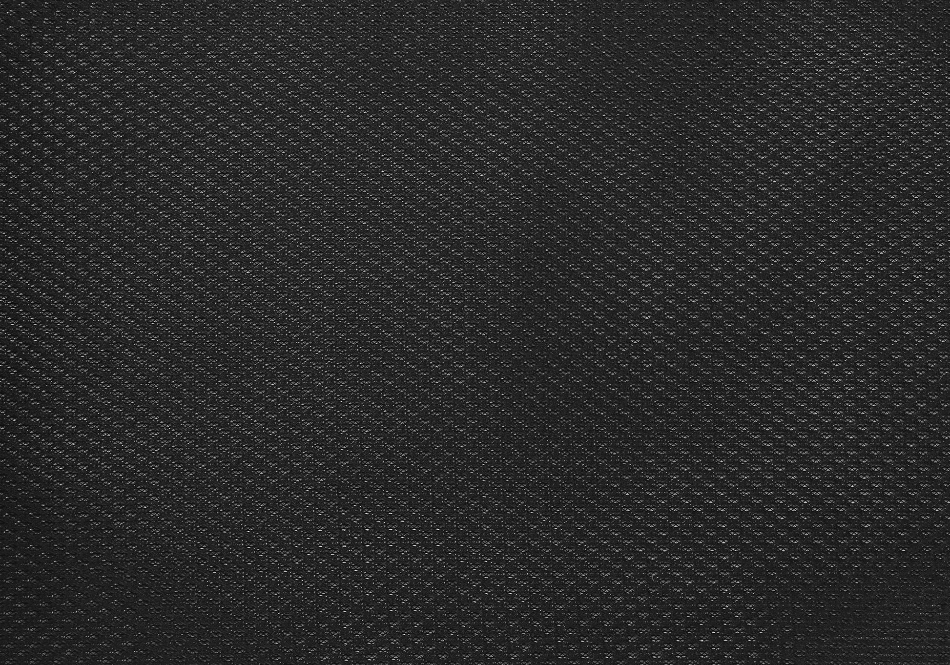 Close-up of the black textured fabric on the Office Chair & Adjustable Height, Swivel, Ergonomic. The subtle diagonal dotted pattern and slight gloss create a grid-like effect across the chair's material.