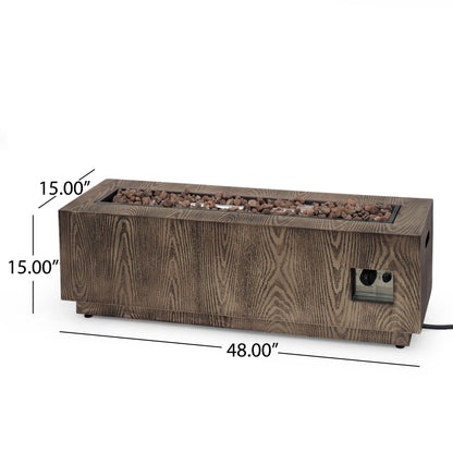 The Wellington Square Iron Fire Pit features a wood pattern design, measures 48" long by 15" high, delivers 50,000 BTU output, and includes lava rocks on top plus a convenient control panel on the side.