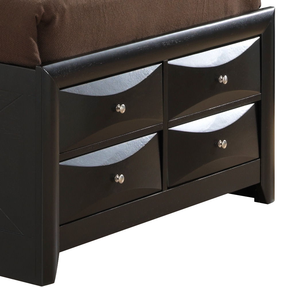 The Marilla Storage Bed with Bookcase Headboard is a black wooden frame featuring four bottom drawers with metallic curved designs and round knob handles, shown here below a brown mattress.