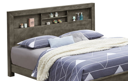 The Bed With Transitional Design Stylish features a gray headboard with built-in shelves displaying décor, and is dressed in gray and white geometric bedding with a white textured blanket at the foot.
