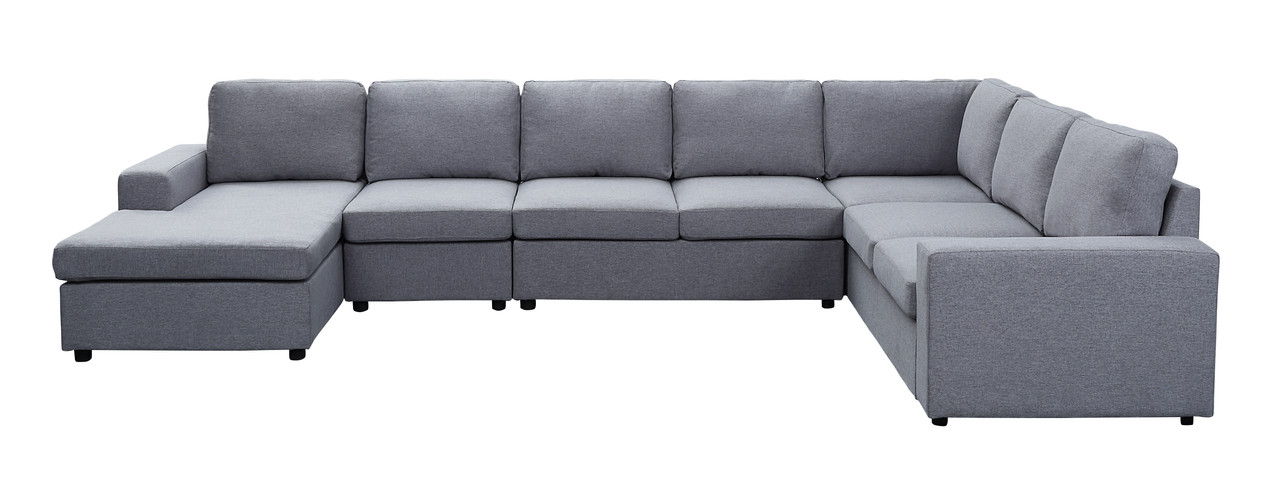 The Hayden - Linen 7 Seat Reversible Modular Sectional Sofa Chaise features light gray fabric, six seat cushions, three back cushions on each side, and a left-end chaise lounge, shown against a white background.