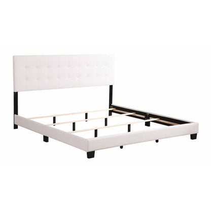 The Caldwell Bed features a modern design with a white tufted headboard, black legs, and wooden slats for mattress support. This simple contemporary frame is sold without a mattress.