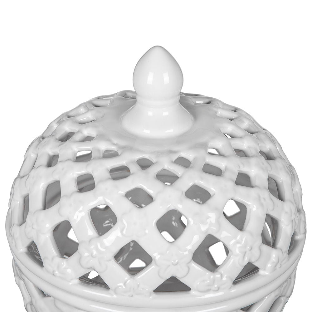 Close-up of the Ceramic Lidded Jar With Lattice Design - White, featuring a glossy white ceramic lid with a lattice pattern, small raised flower details, and a smooth pointed finial.
