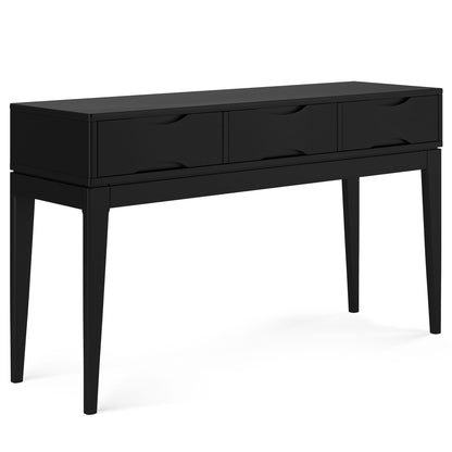 The Harper Handcrafted Console Sofa Table features a modern black finish, three drawers with integrated handles, sleek tapered legs, minimalist design, and smooth surfaces.