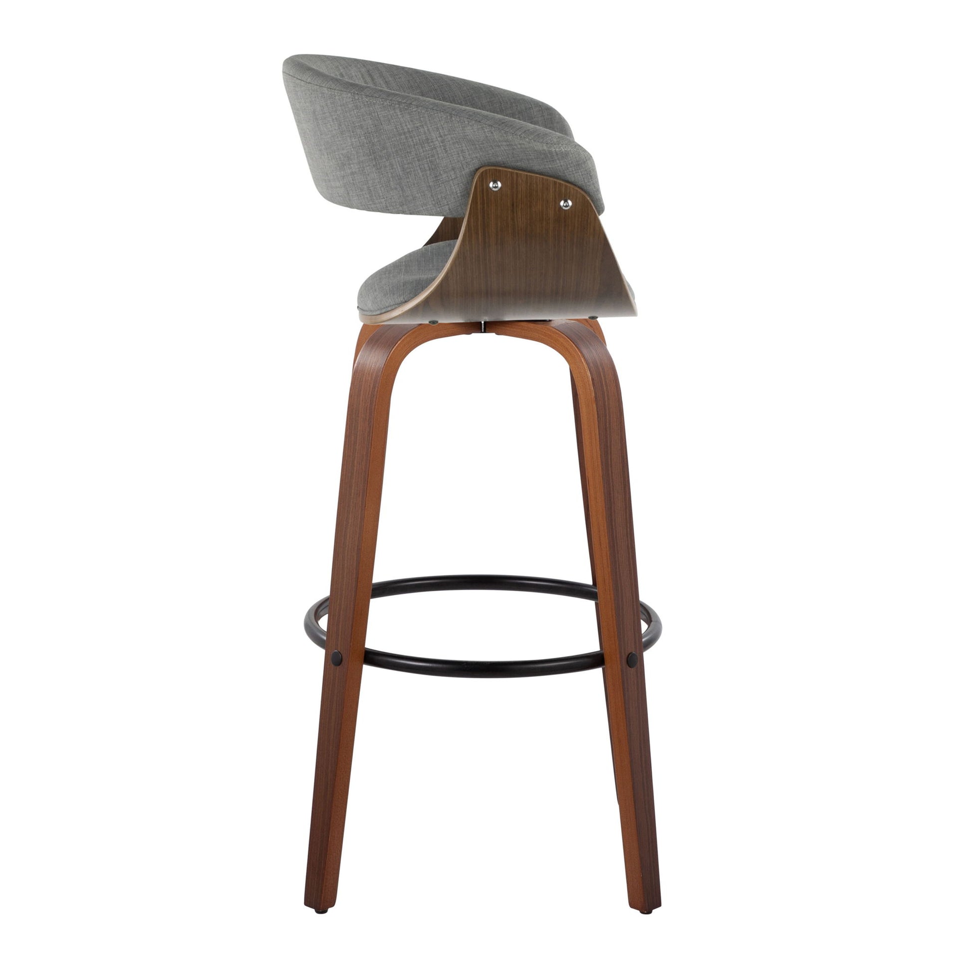 The Vintage Mod Mid Century Modern Fixed Height Barstool Set features a curved wooden frame, four angled legs, a round black footrest, and gray upholstered seat and backrest, shown here from the side.