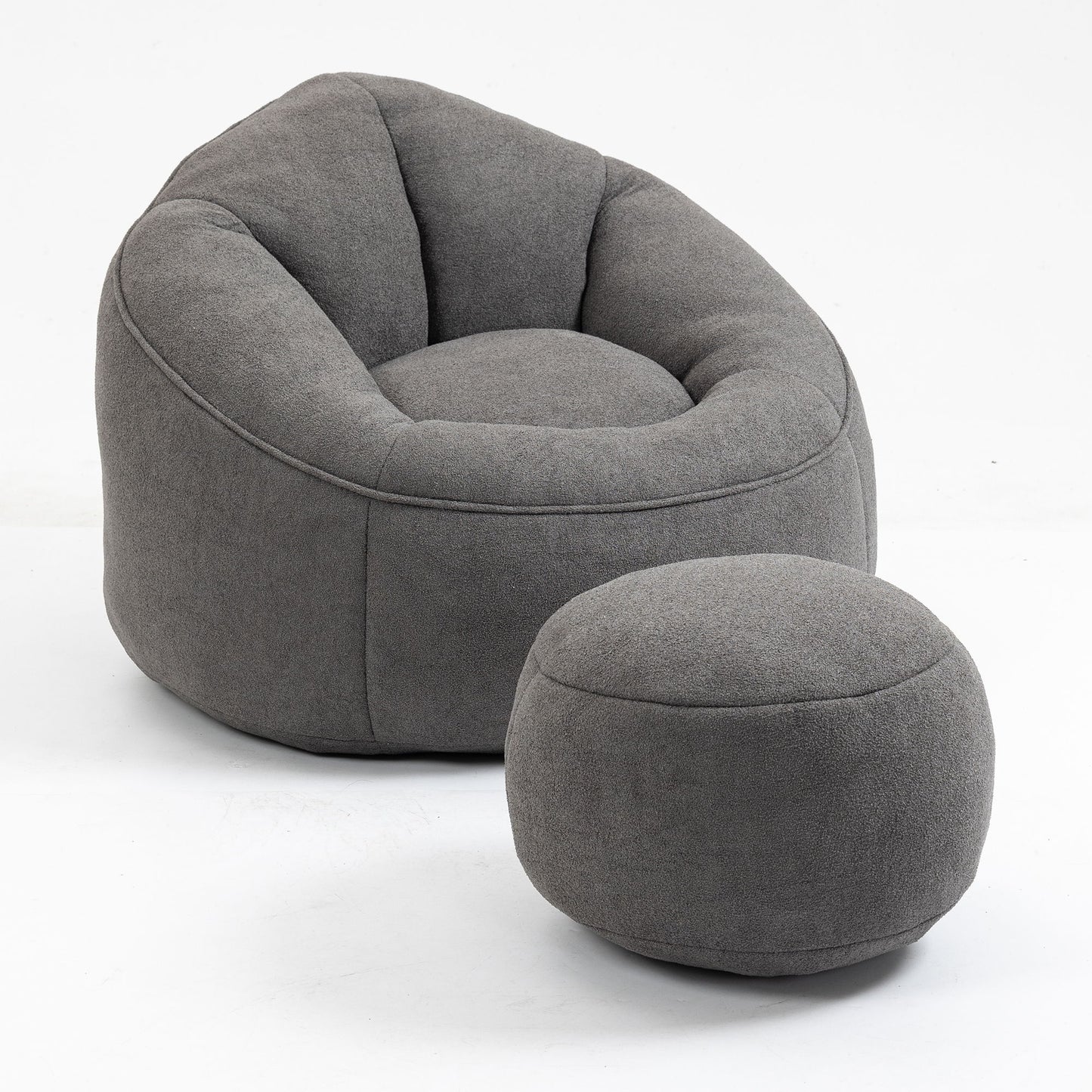 The Bedding Bean Bag Sofa Chair, made of high pressure foam with a matching footrest, features a modern gray fabric design with a rounded back and both pieces are shown against a plain white background.