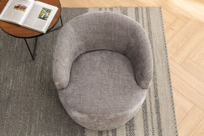 A top-down view of the Chenille Fabric Swivel Accent Armchair Barrel Chair with a gray, rounded design on a patterned rug, beside a small round table holding an open book. The flooring is light wood in a herringbone pattern.