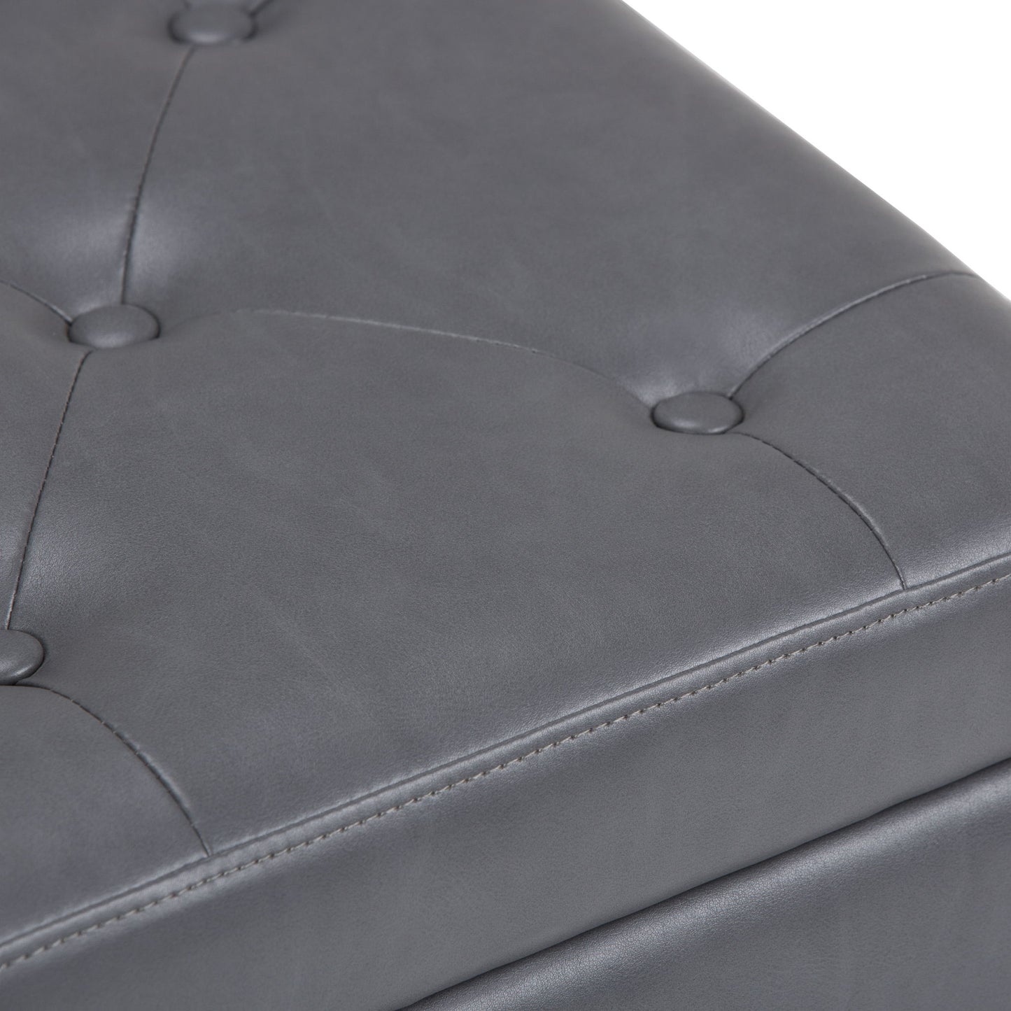 Close-up of the gray, tufted leather surface with button accents and visible stitching on the Hamilton - Upholstered Storage Ottoman.
