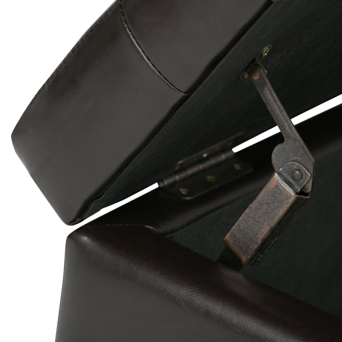 Close-up view of the Cosmopolitan - Upholstered Storage Ottoman in dark brown leather with its lid open, revealing the metal hinge and support mechanism inside.