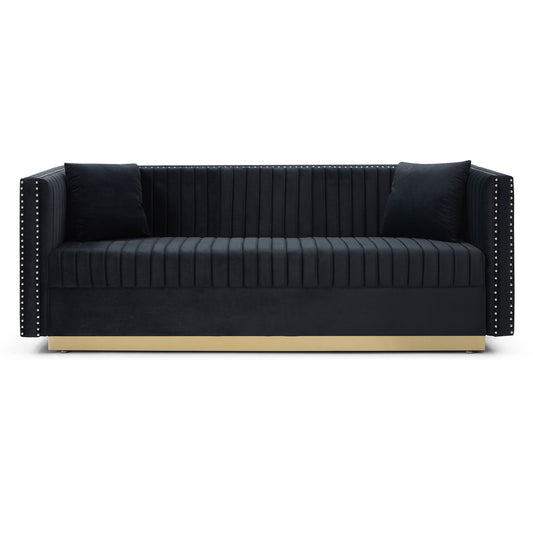 The Contemporary Vertical Channel Tufted Sofa is a modern upholstered black velvet couch featuring vertical stitching, two matching pillows, studded armrest detailing, and a gold base—perfect for your living room.