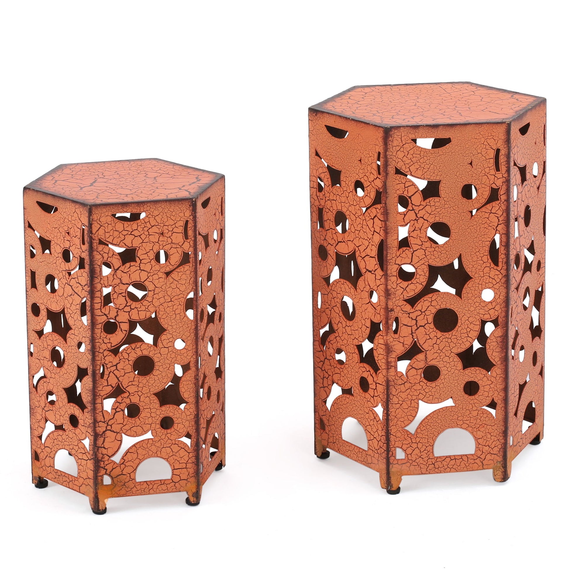 The Selva - Accent Table Set features two hexagonal orange metal side tables with a crackle finish and geometric cut-out patterns, in two different heights, displayed against a white background.