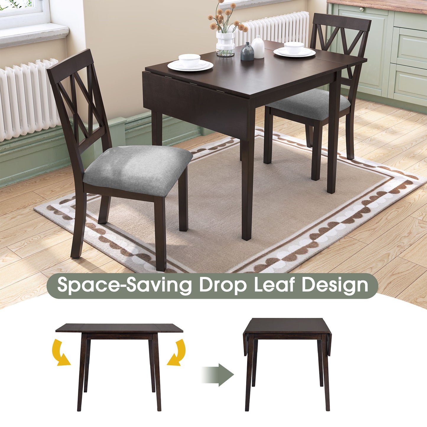 The 3 Piece Kitchen Dining Set features a drop leaf dining table and 2 upholstered chairs on a rug in a kitchen. The table is shown extended and folded, with "Space-Saving Drop Leaf Design" below, plus a vase and books on top.