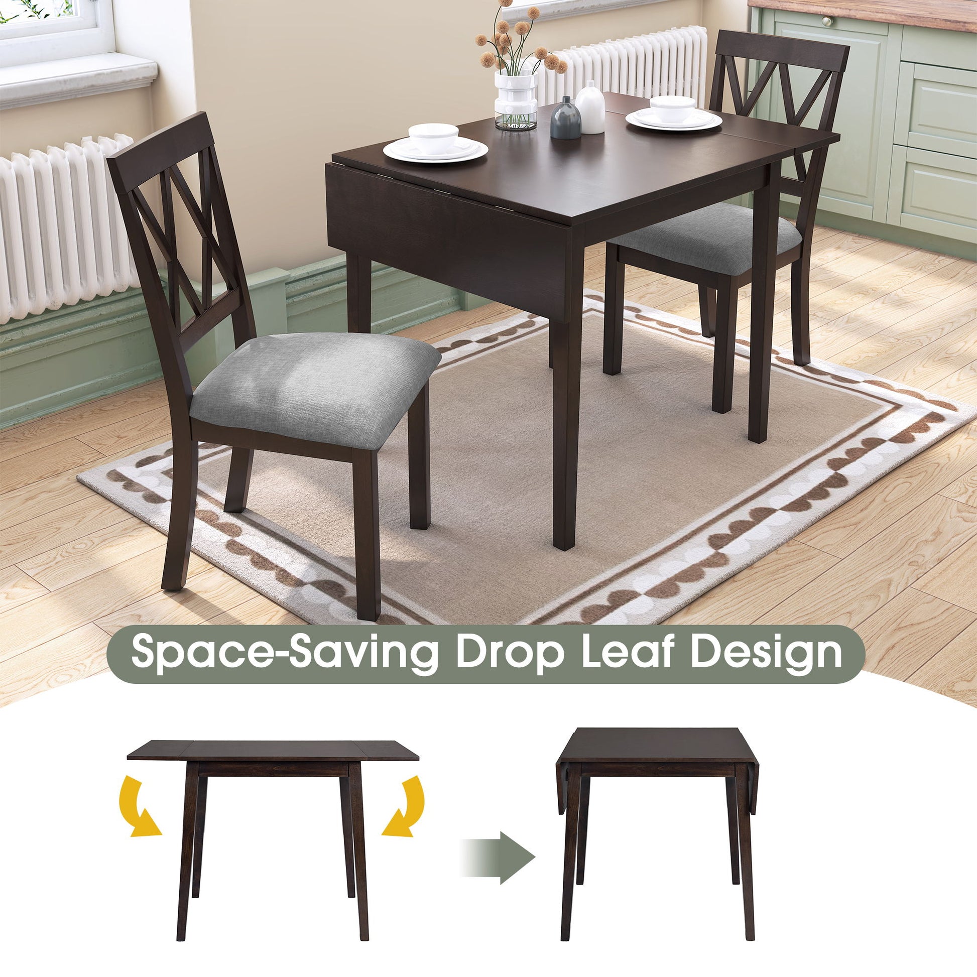 The 3 Piece Kitchen Dining Set features a drop leaf dining table and 2 upholstered chairs on a rug in a kitchen. The table is shown extended and folded, with "Space-Saving Drop Leaf Design" below, plus a vase and books on top.