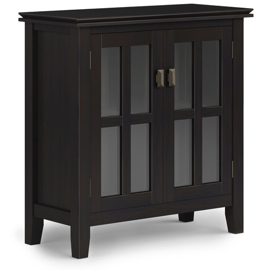 The Couch.com Artisan Low Storage Cabinet in Hickory Brown features wood construction, a dark brown finish, glass-paneled double doors with metal handles, four short legs, and a simple modern design.