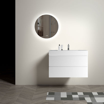 A modern minimalist bathroom features an Alice floating vanity with a one-piece sink basin below a round backlit mirror. Two soap dispensers sit atop the vanity, geometric tiles cover the floor, and the walls are painted a light neutral color.