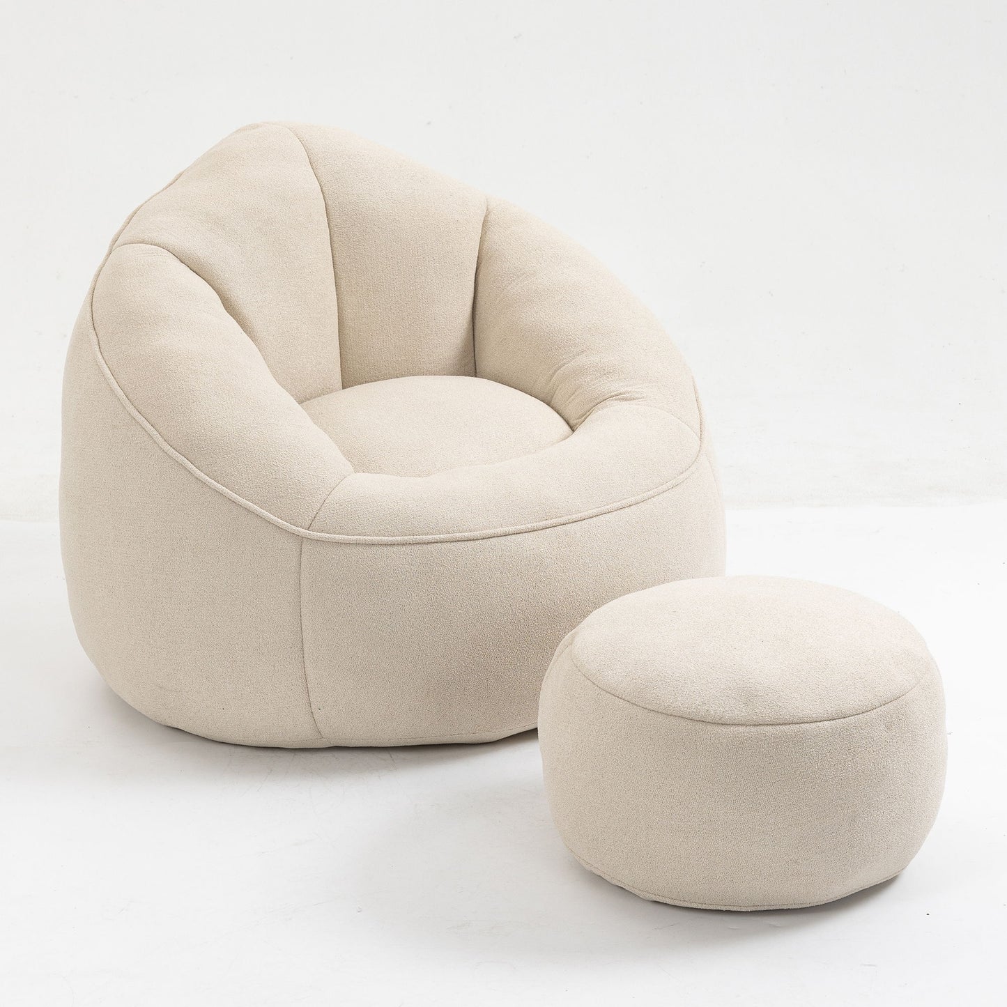 The Bedding Bean Bag Sofa Chair, upholstered in beige high pressure foam, features rounded cushioned edges and comes with a matching round footrest, both displayed on a white background.