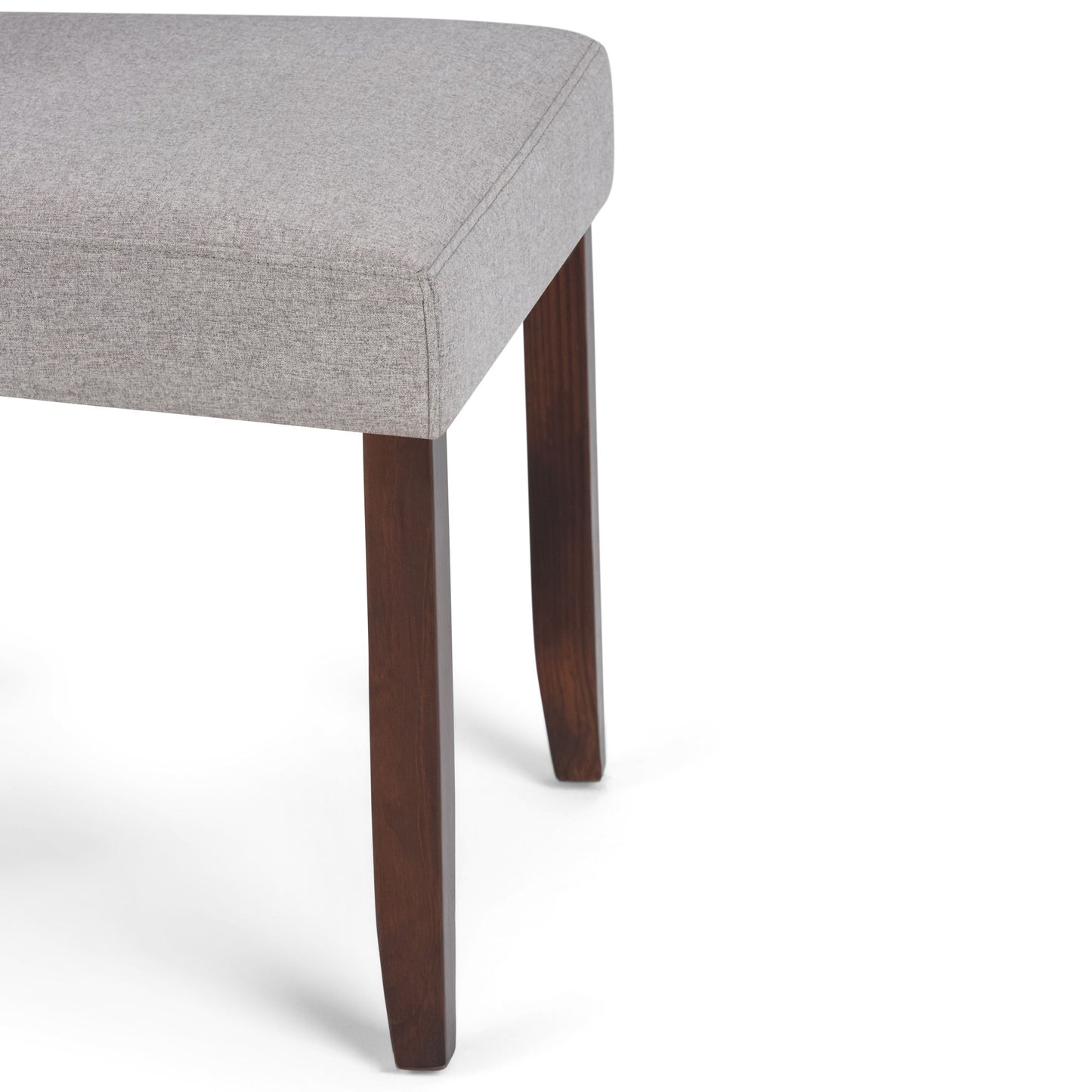 Close-up of the Acadian - Upholstered Parson Dining Chair (Set of 2) featuring a light gray upholstered seat and dark wooden legs, displayed against a white background.