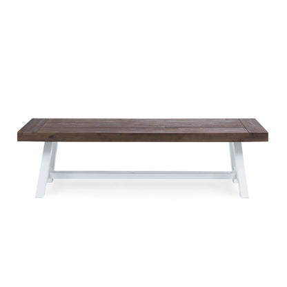 The Tranquilizer outdoor bench features a rectangular acacia wood seat with a slat panel design and sturdy angled white legs, shown against a plain white background.