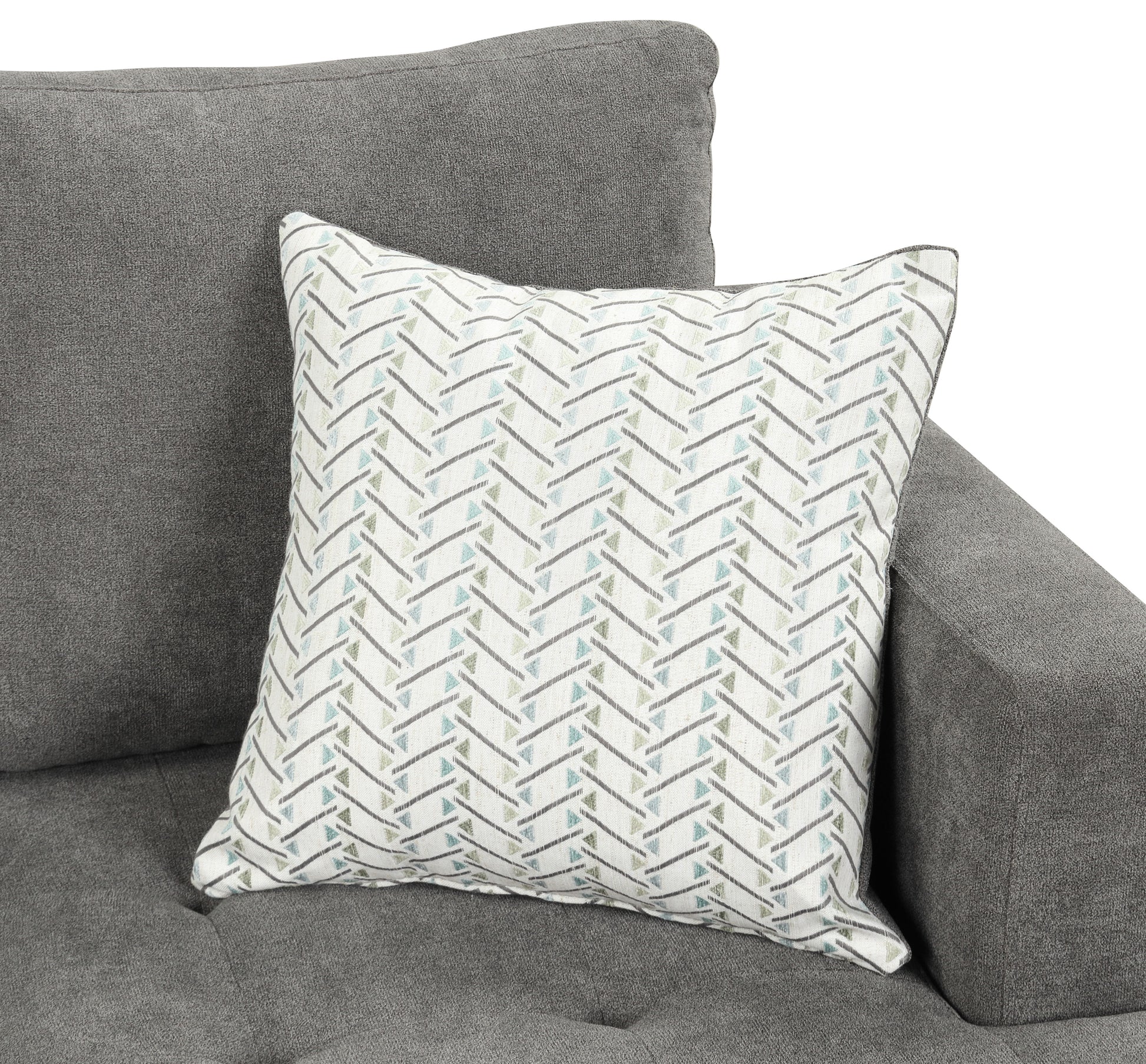 A gray Callaway Chenille Chair features a decorative throw pillow with a white cover and zigzag pattern in blue and green shades, placed in the corner.