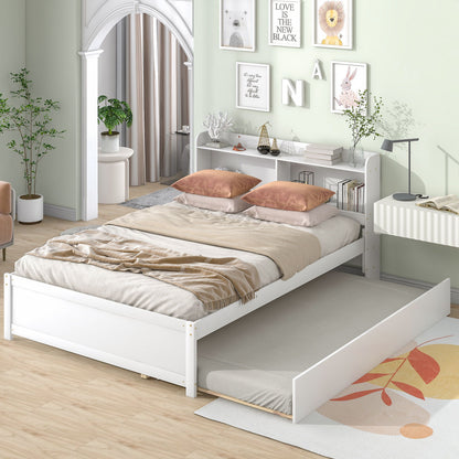 A modern bedroom features the Full Bed With Trundle, Bookcase in white, with beige bedding, peach pillows, and a floral rug. Art and decor are on shelves against pastel green walls, complemented by nearby plants.