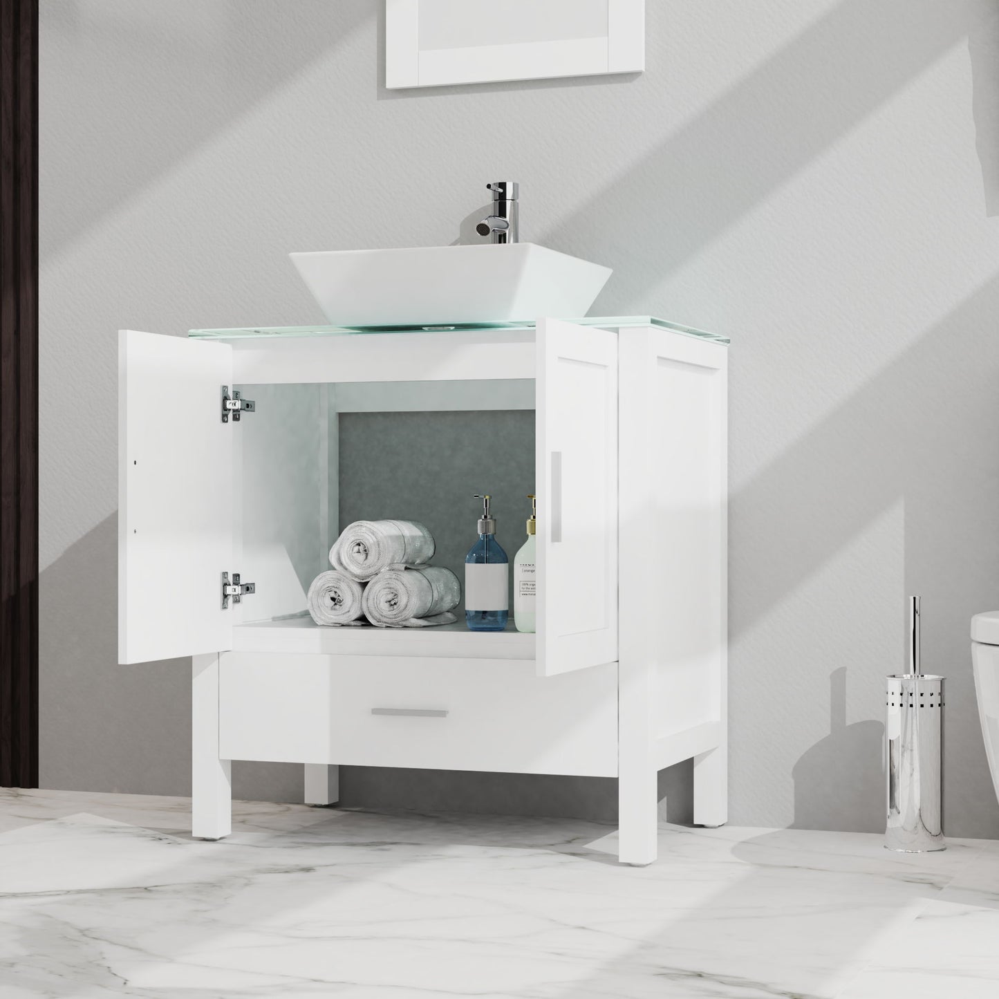 The Bathroom Vanity And Sink Combo Glass Top Cabinet With Mirror features open cabinet doors displaying towels and bottles, a square vessel sink above, and a white drawer below, set against a light wall with a marble floor.