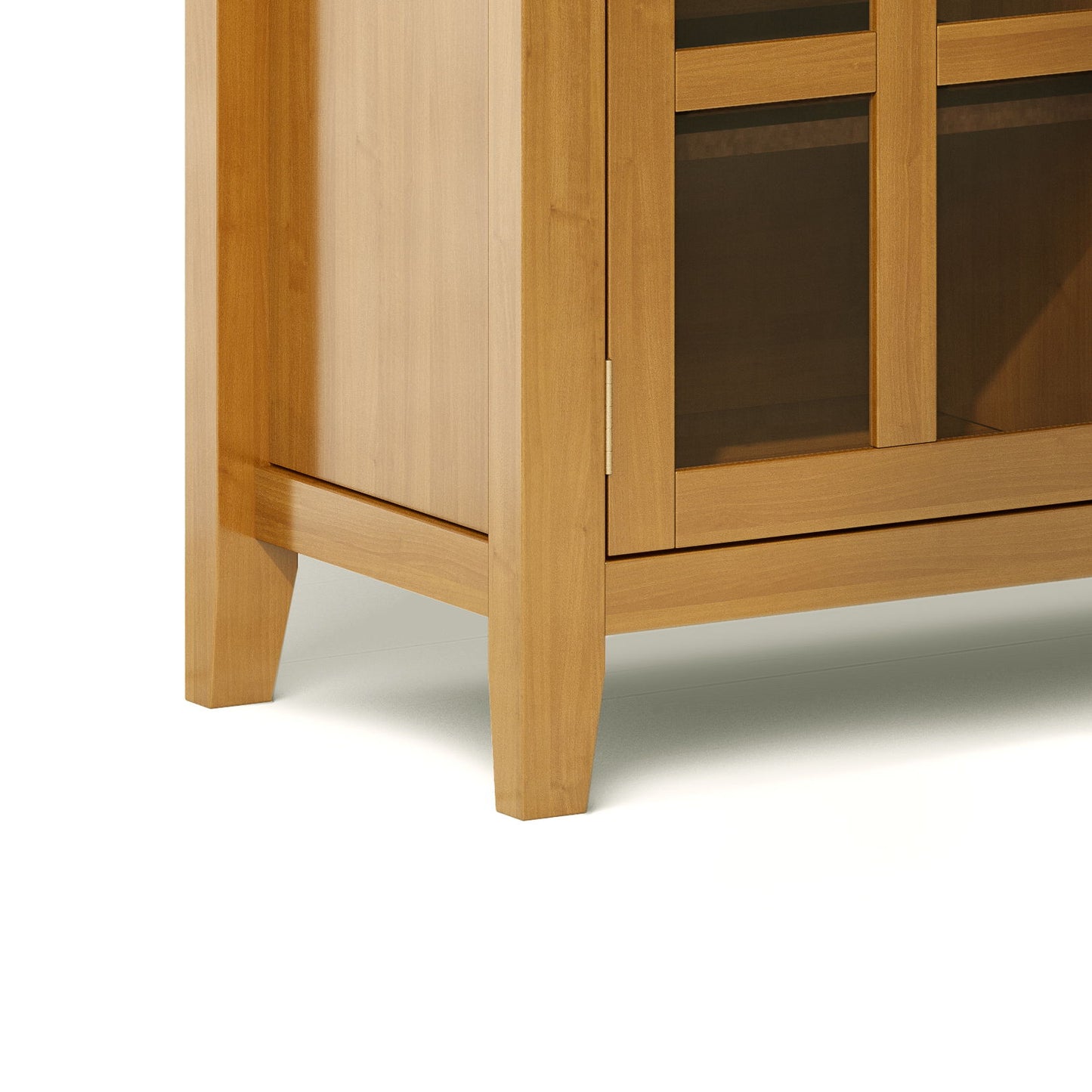 Close-up of the lower corner of the Artisan - Handcrafted Sideboard Buffet, featuring light wood legs, frame, glass panel doors, and part of the side panel set against a white background.