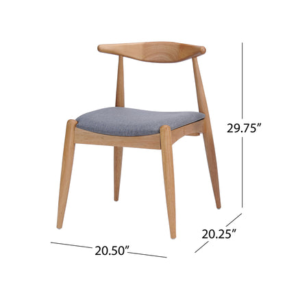 The Candescent Dining Chair features a wood frame, curved back, gray cushioned seat, and angled legs. Each chair measures 29.75" H x 20.50" W x 20.25" D and comes in a set of 2.