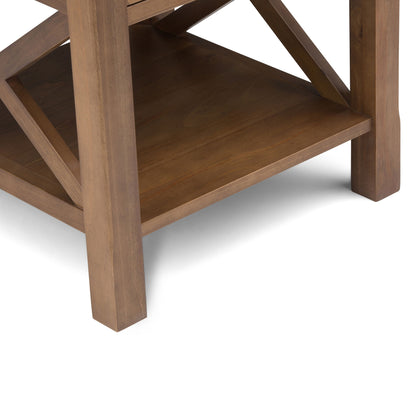 Close-up of the Kitchener End Table in Medium Saddle Brown, highlighting its lower shelf and crossed support beams at the bottom corner.